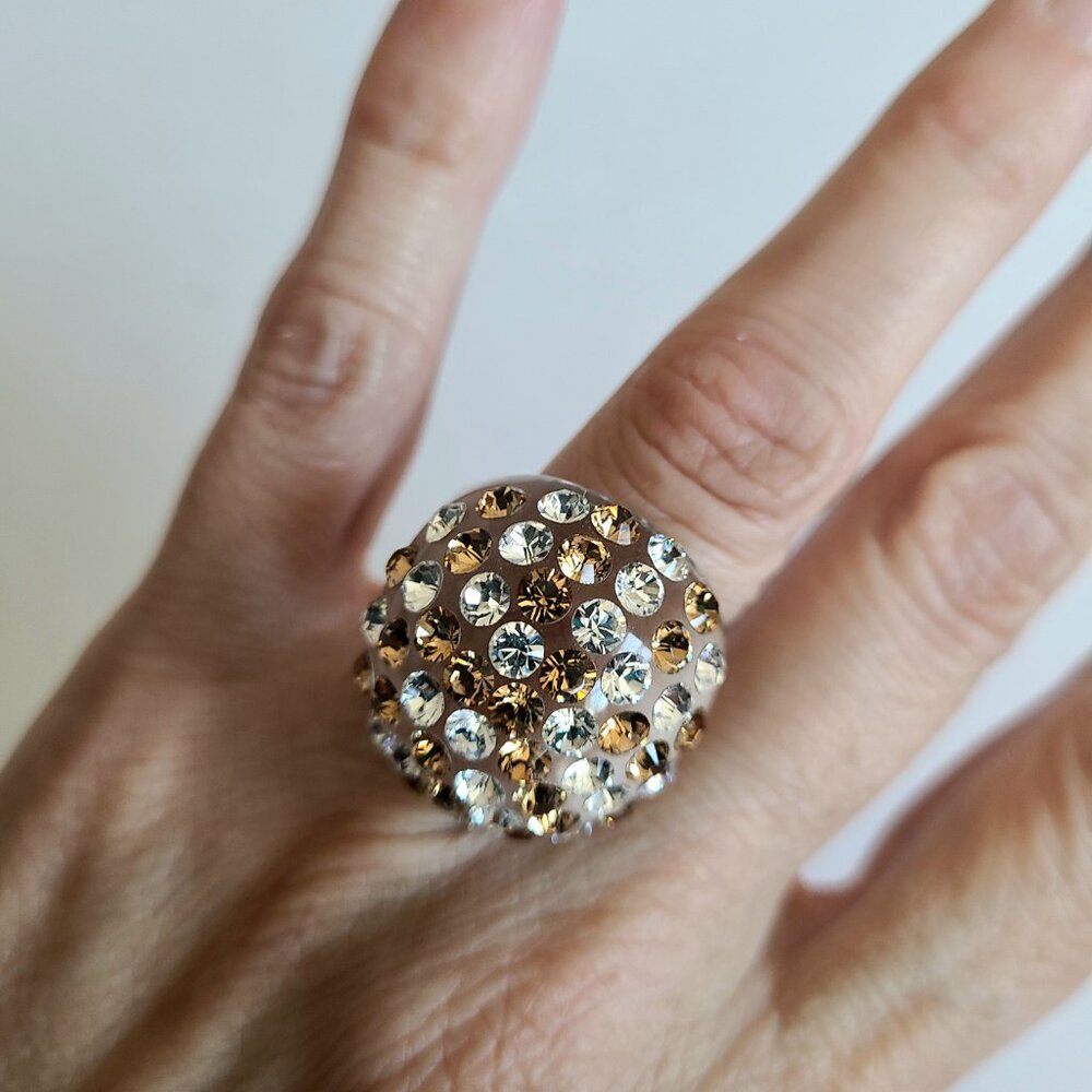 Clear acrylic Lucite dome cocktail ring with gold and clear rhinestones.